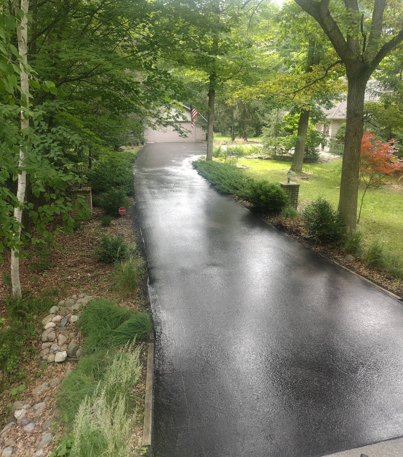 Premium Landscaped Driveway - Fresh Sealcoat